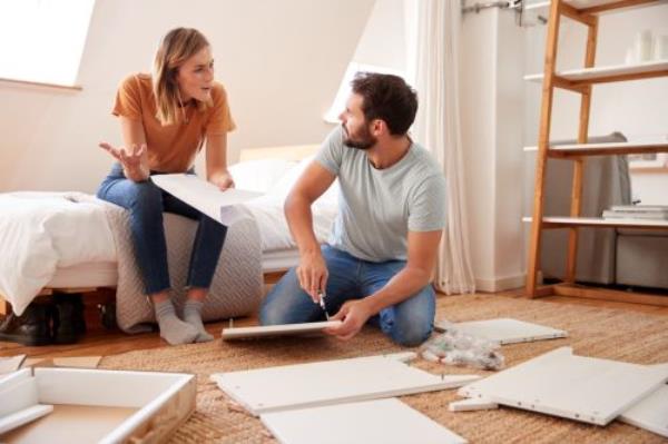 couple havin<em></em>g argument while assembling furniture in their home